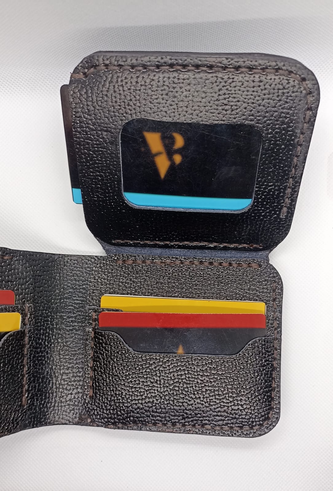 Black leather wallet with card slots on a white background