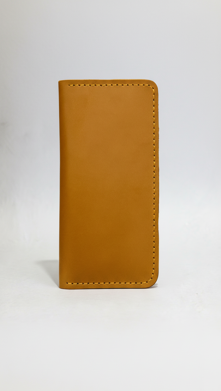 Tan leather wallet on a white background