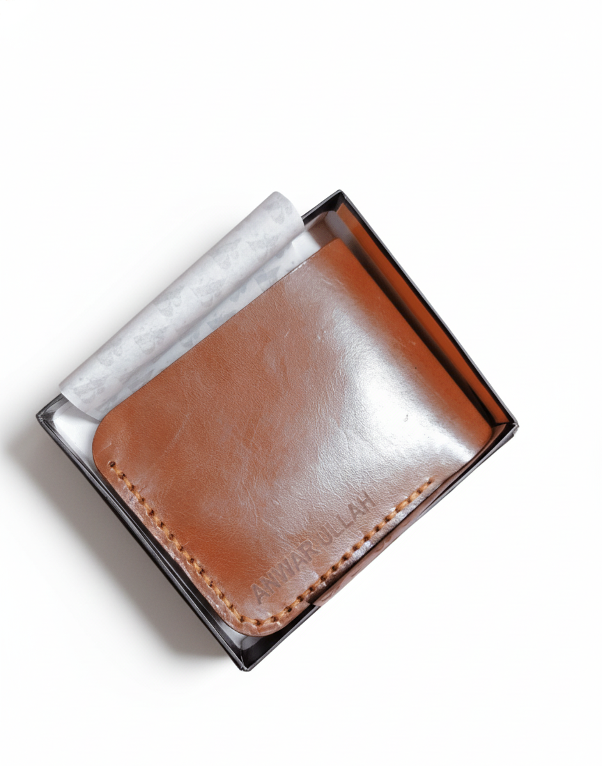 Brown leather wallet in a clear box on a white background