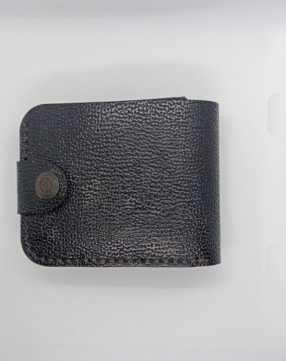 Black leather wallet on a light gray background