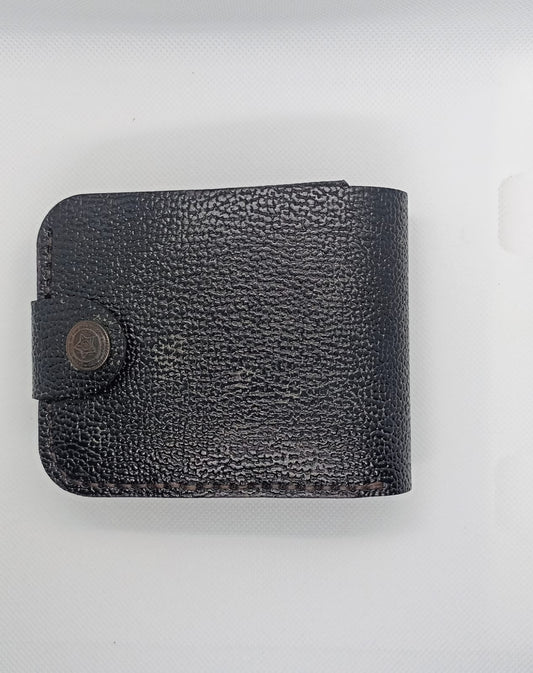 Black leather wallet on a light gray background
