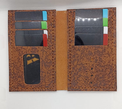 Brown leather wallet with card slots on a white background