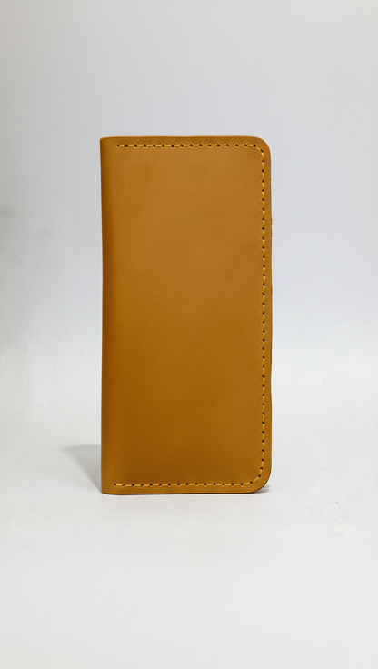 Tan leather wallet on a white background